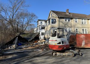 View of debris on ground where garage once stood
